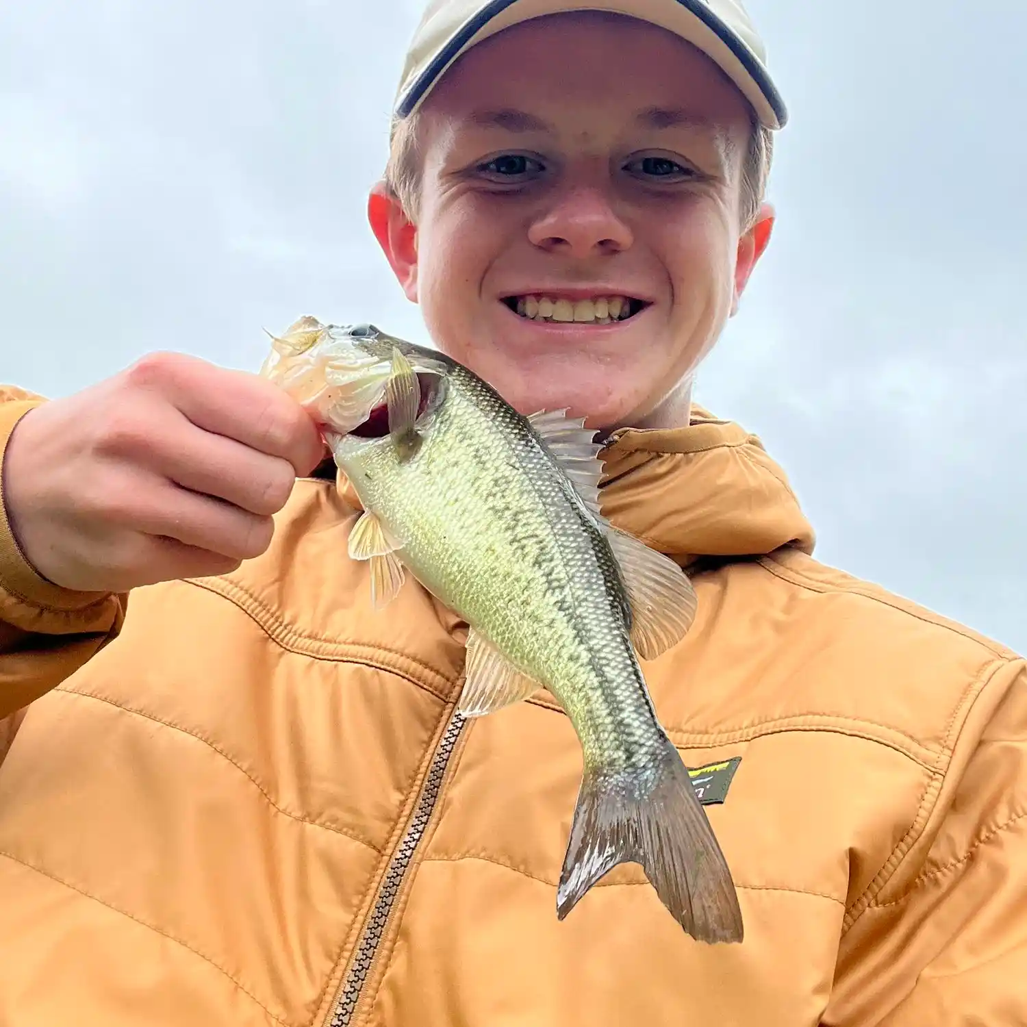 A young angler holds his latest catch / CFAP Photo Gallery