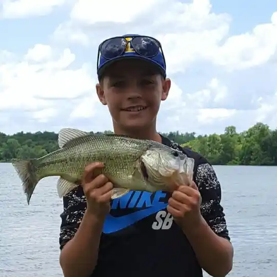 Jamesville boy reels in big bass while fishing with father on